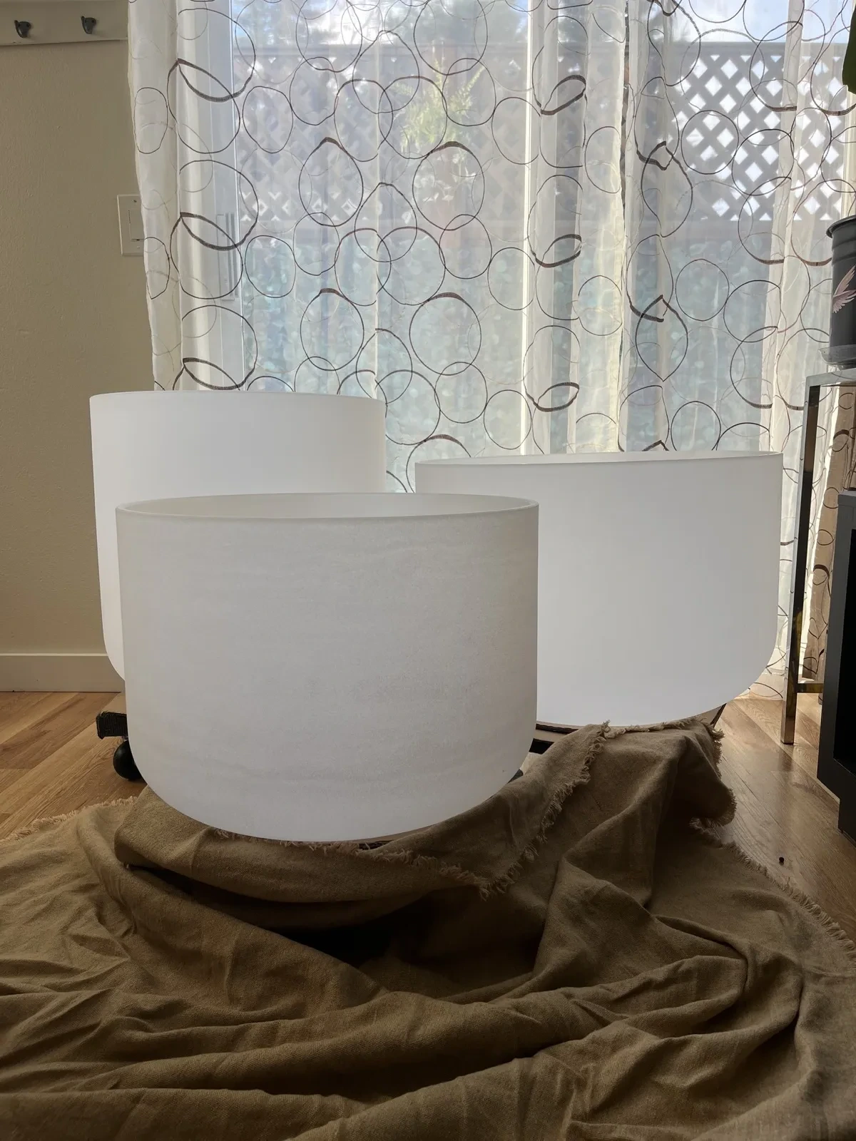 Crystal singing bowls prepared in a bright room